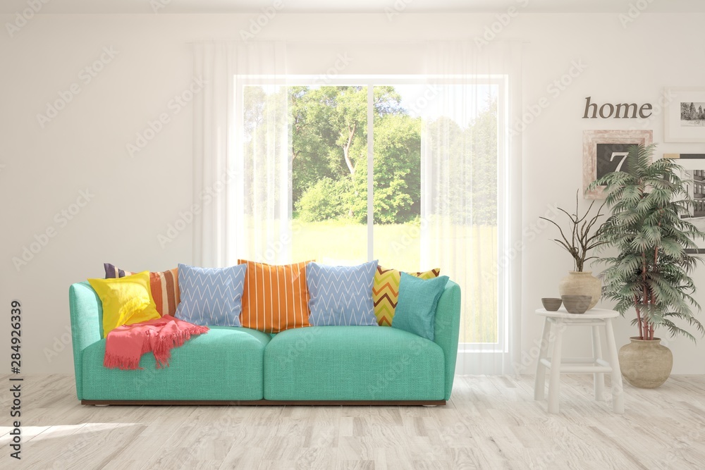 Fototapeta premium Stylish room in white color with sofa and summer landscape in window. Scandinavian interior design. 3D illustration