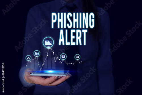 Text sign showing Phishing Alert. Business photo text aware to fraudulent attempt to obtain sensitive information Woman wear formal work suit presenting presentation using smart device