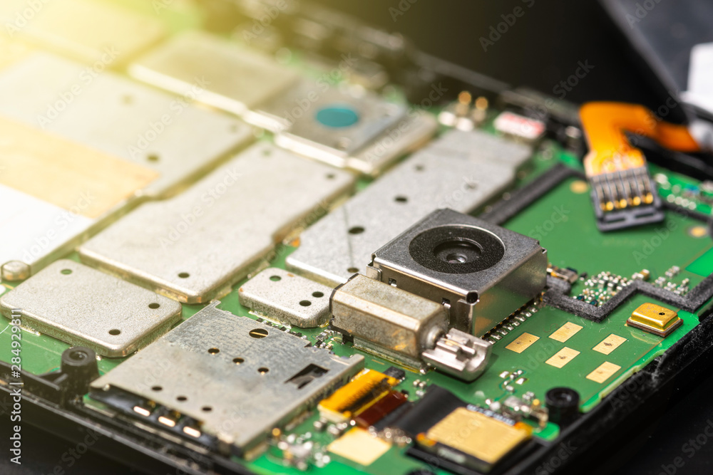 Repairing a broken smartphone, open and disassembled closeup macro Repairing a broken smartphone, open and disassembled closeup macro