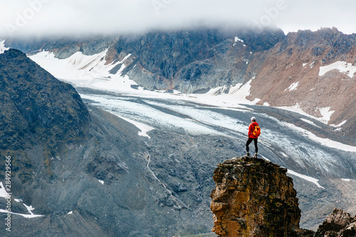 A woman takes in the view on a hike in Lake Clark National Park and Preserve, Alaska, USA photo