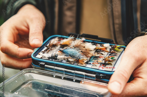 Quadro su tela Box flies for fly fishing in hand fisher