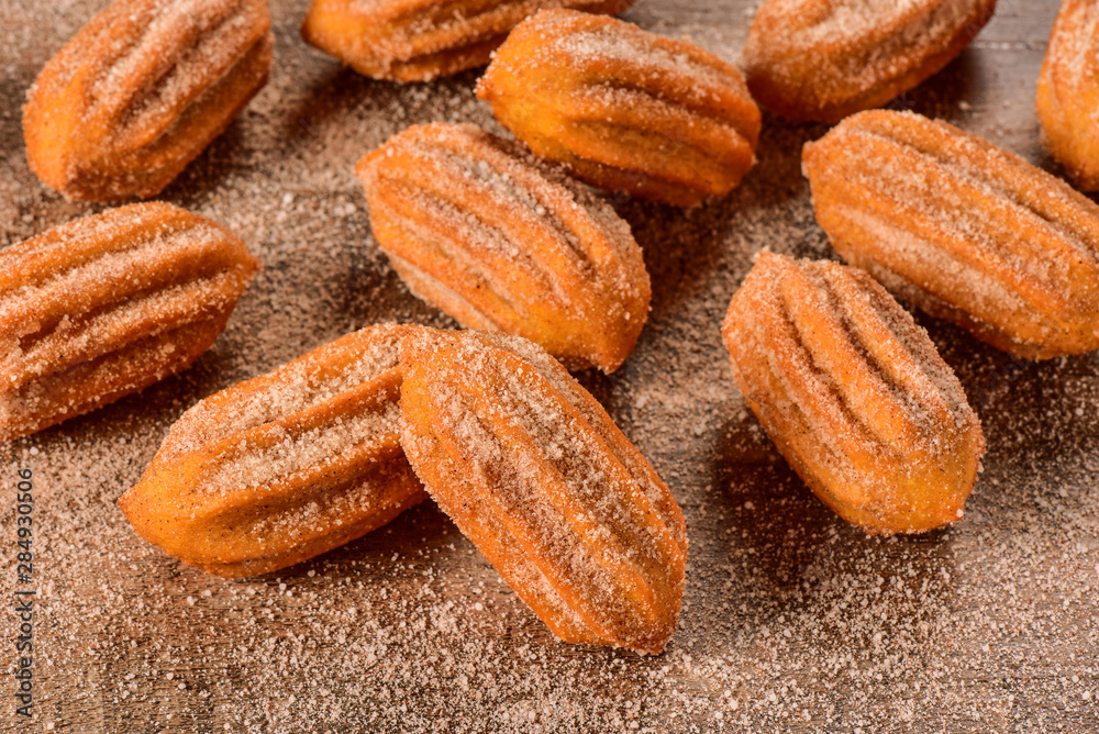 Dulce de leche churro on wooden background Dulce de leche churro on wooden background