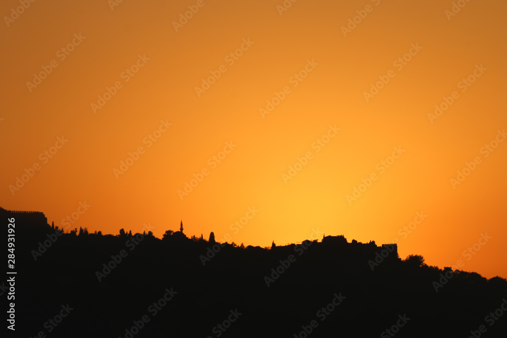 silhouette of alanya city at sunset