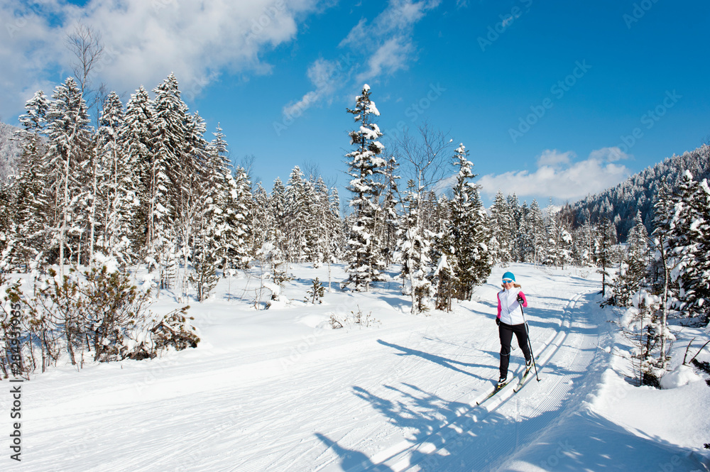 Germany, Bavaria, Aschermoos, Senior woman doing cross-country skiing Germany, Bavaria, Aschermoos, Senior woman doing cross-country skiing