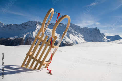 Switzerland, Graubuenden, Savognin, Winter scenery with sledge photo