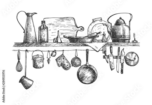 Cooking tools and containers on wall