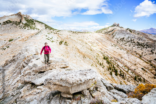 USA, California, Yosemite National Park, a woman is hiking near Echo Peaks.