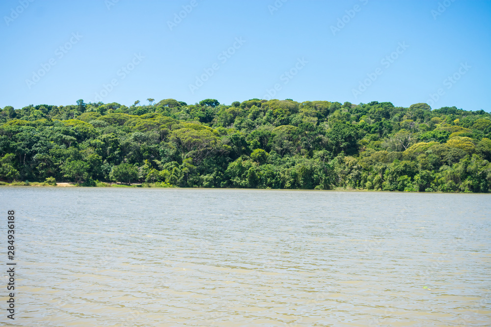 Lagoa da Mata, beautiful lagoon surrounded by preserved Atlantic Forest on Itamaraca island, Brazil Lagoa da Mata, beautiful lagoon surrounded by preserved Atlantic Forest on Itamaraca island, Brazil