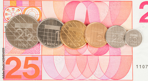 Dutch Guilders all coins on a 25 Guilder note, the former dutch official curency untill the Euro