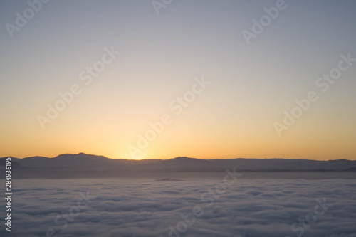 start of sunrise in the mountains and sea of clouds