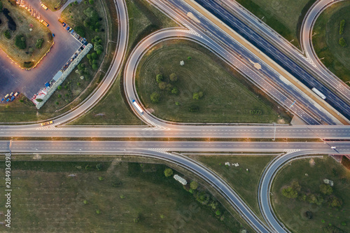 Aerial drone photography of the city suburbs, highway around the main city. 