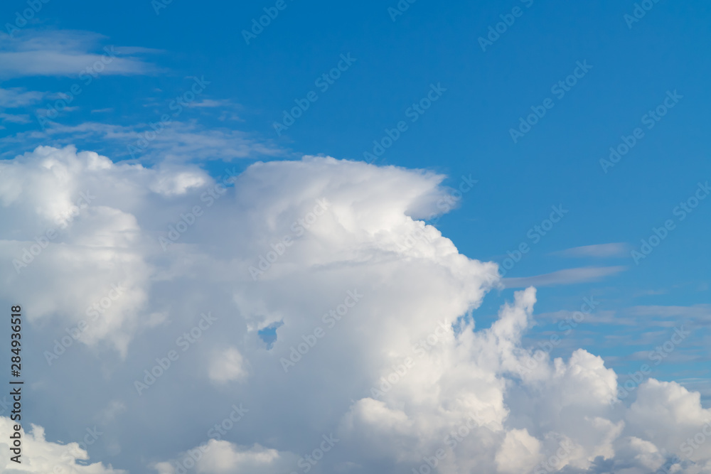 beautiful white cumulus clouds in the blue sky during the day