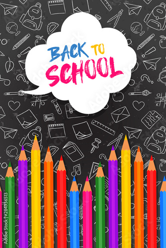 Back to school card color pencils on blackboard