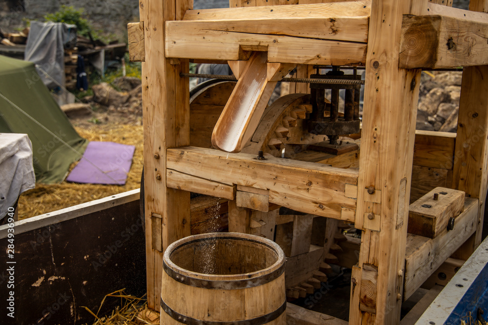 small hand made wooden mill for grain for bread in European village country side place small hand made wooden mill for grain for bread in European village country side place