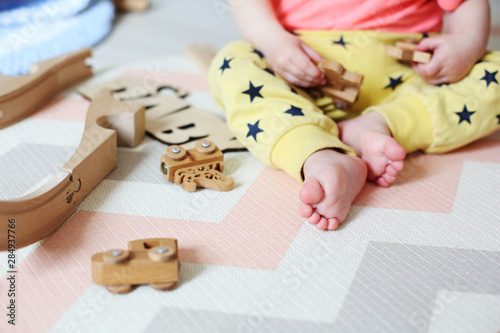 little boy with wooden toys