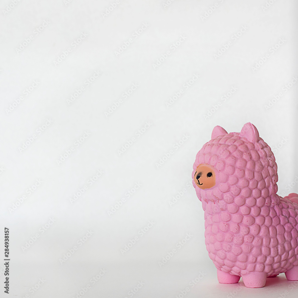 Pink small llama squishy on white empty background. Square with Soft toy for kids, antistress. Stock Photo | Adobe