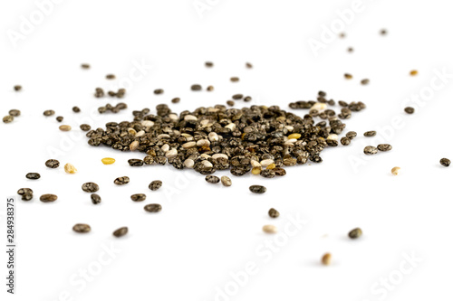 Pile of healthy chia seeds isolated on a white background. Healthy breakfast, vitamin snack, diet and healthy eating concept.