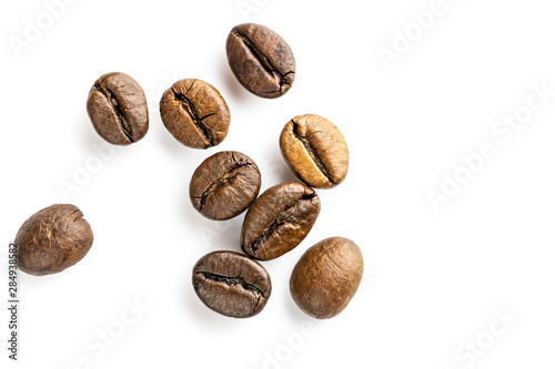 Roasted coffee beans for espresso, cappuccino on white background.