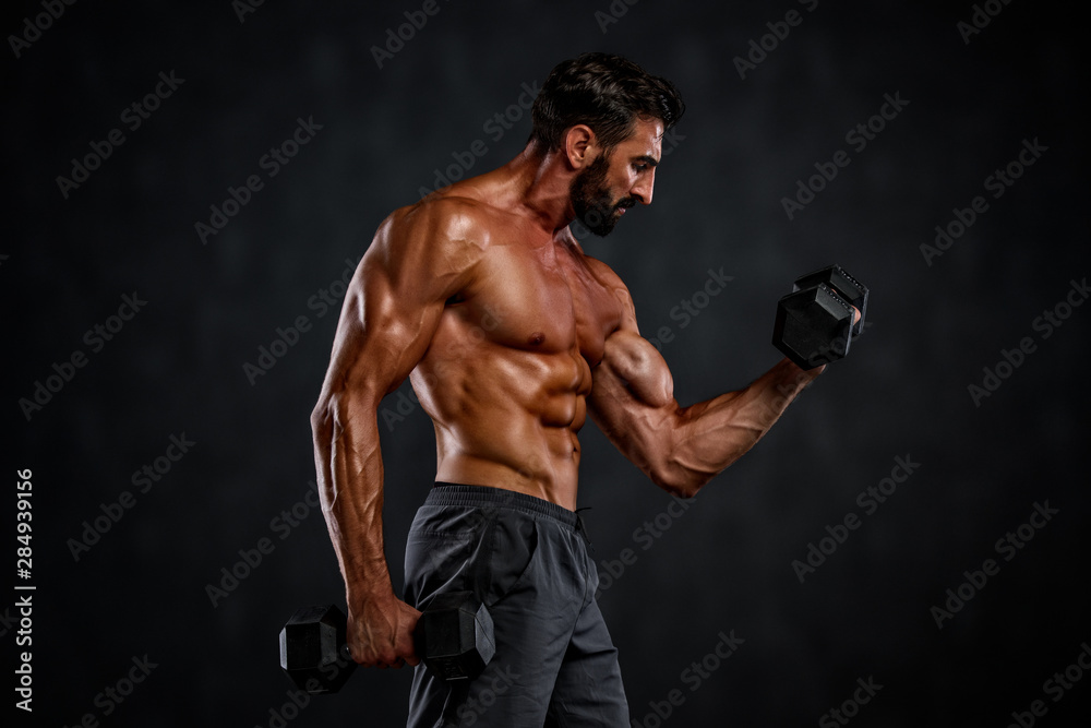 Strong Handsome Muscular Men Lifting Weights , Performing Dumbbell Exercises for Biceps