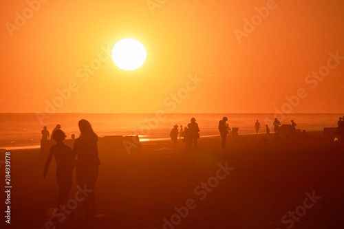 silhouette of people on the beach