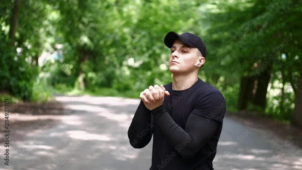 fit man stretching outside before a workout fit man stretching outside before a workout