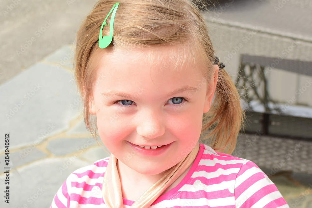 Joyful smiling child. The face of a caucasian child close-up. Emotions