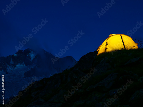 Hiking tent in the italian alps at night