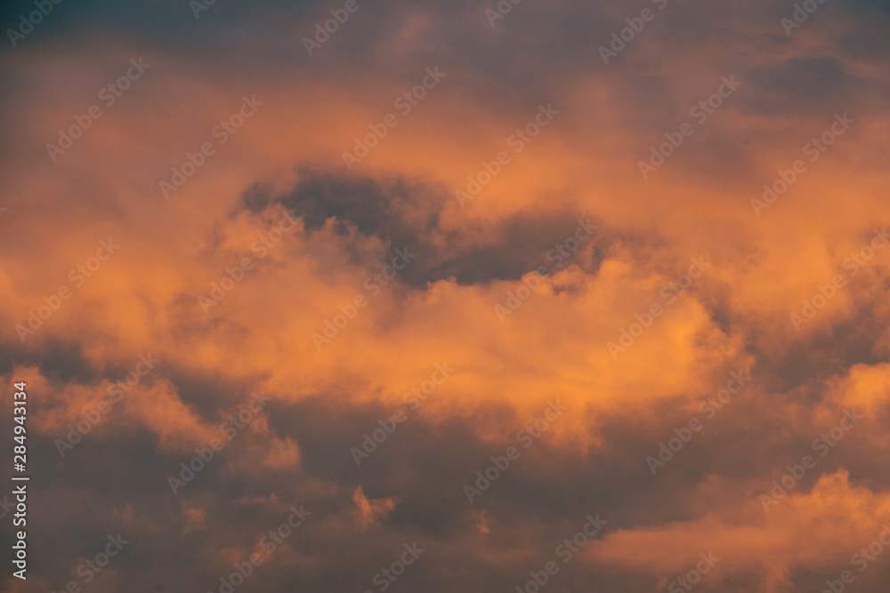 Sky at sunrise. Dramatic skyscape with bright pink clouds