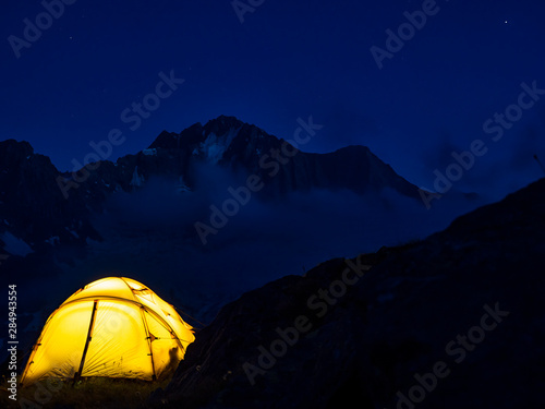 Fototapeta Naklejka Na Ścianę i Meble -  Hiking tent in the italian alps at night