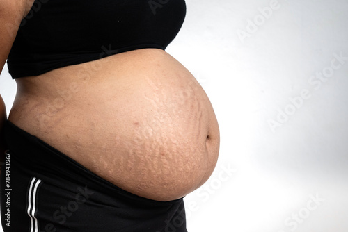 Pregnant asian women isolated on a white background