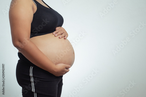 Pregnant asian women isolated on a white background