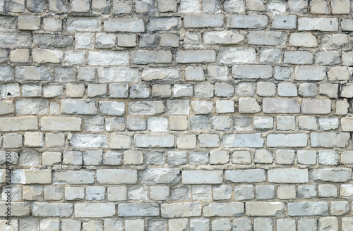 Old weathered white brick wall