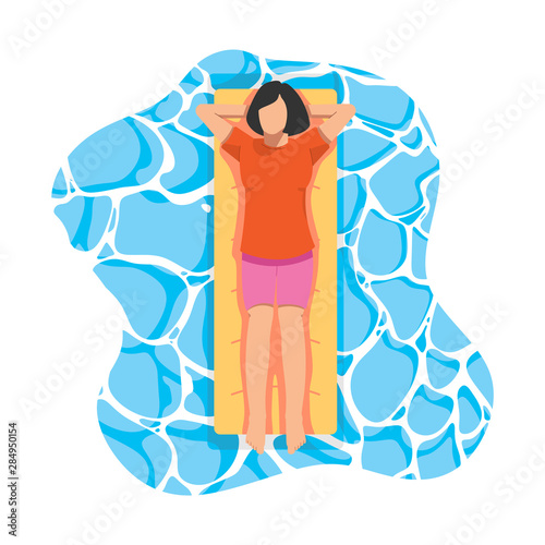 Girl top view on yellow mattress in pool