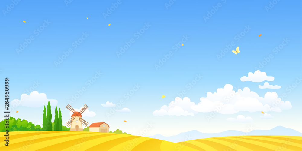 Autumn farm scene with a windmill and fields