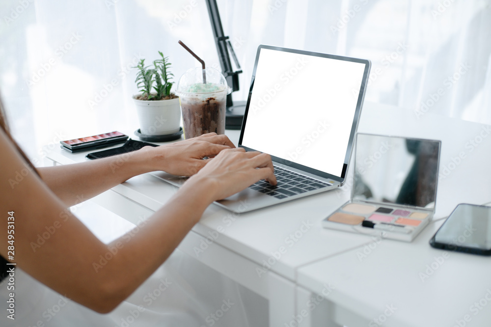 Mockup image of beautiful woman holding credit card enjoying in shopping website online with smartphone and laptop, mockup concept Mockup image of beautiful woman holding credit card enjoying in shopping website online with smartphone and laptop, mockup concept