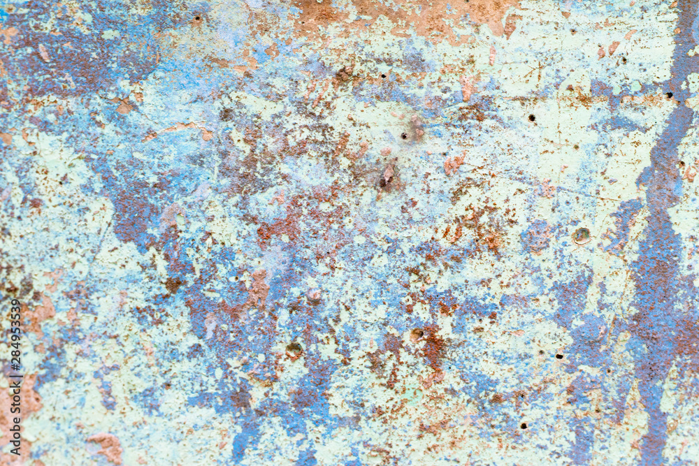 Concrete textured background with crack of blue color painting