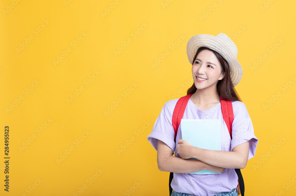 Young asian girl student holding the book and looking Young asian girl student holding the book and looking