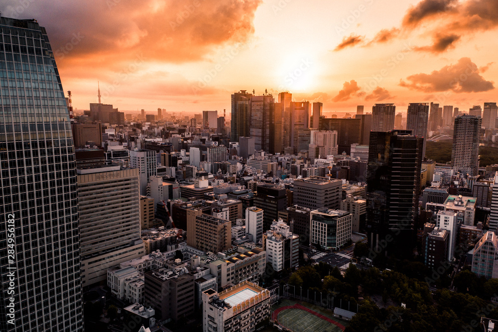 Obraz premium Aerial Drone Photo - Skyline of the city of Tokyo, Japan at sunrise. Asia