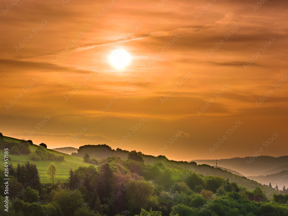 A few minutes after sunrise into a dark, cloudy sky A few minutes after sunrise into a dark, cloudy sky