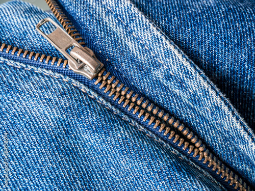 Close up of broken zipper on jeans