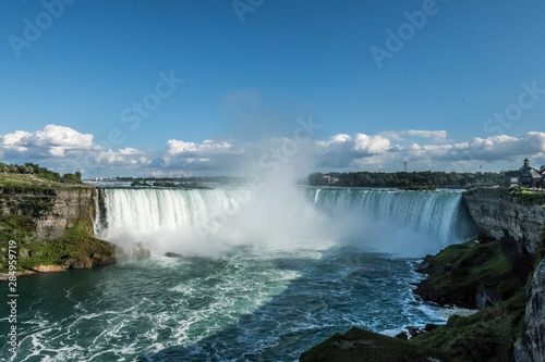 Horseshoe Falls  also known as Canadian Falls  is the largest of the three waterfalls that collectively form Niagara Falls on the Niagara River along the Canada   United States