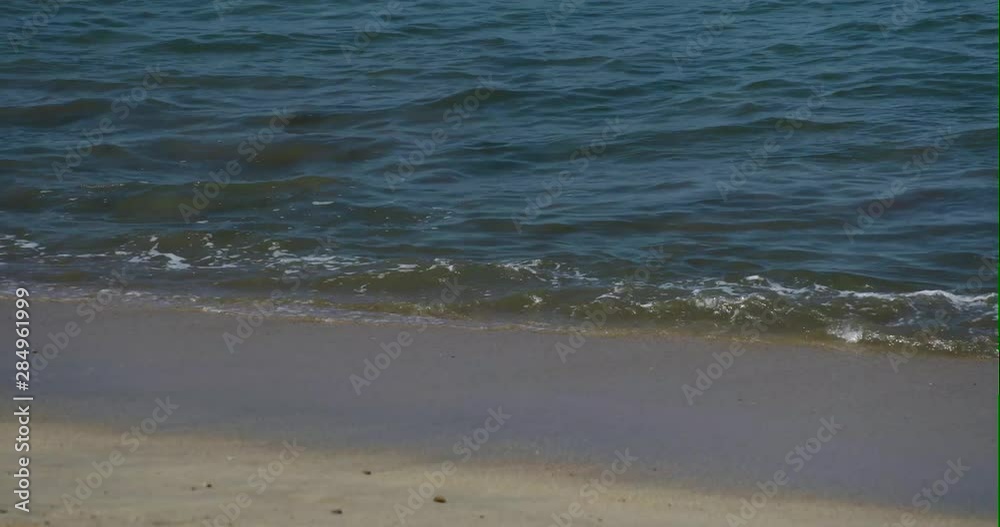 Ocean waves calmed crashing at the beach Ocean waves calmed crashing at the beach