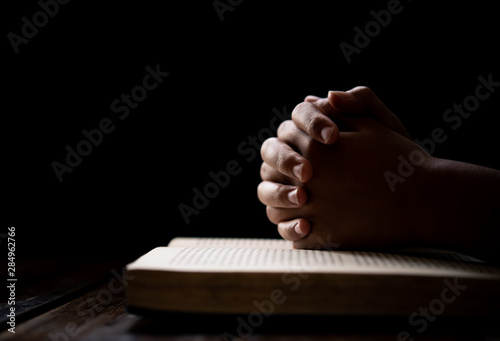 Fotografia, Obraz hands woman laying on the biblical while praying for christian religion blessing