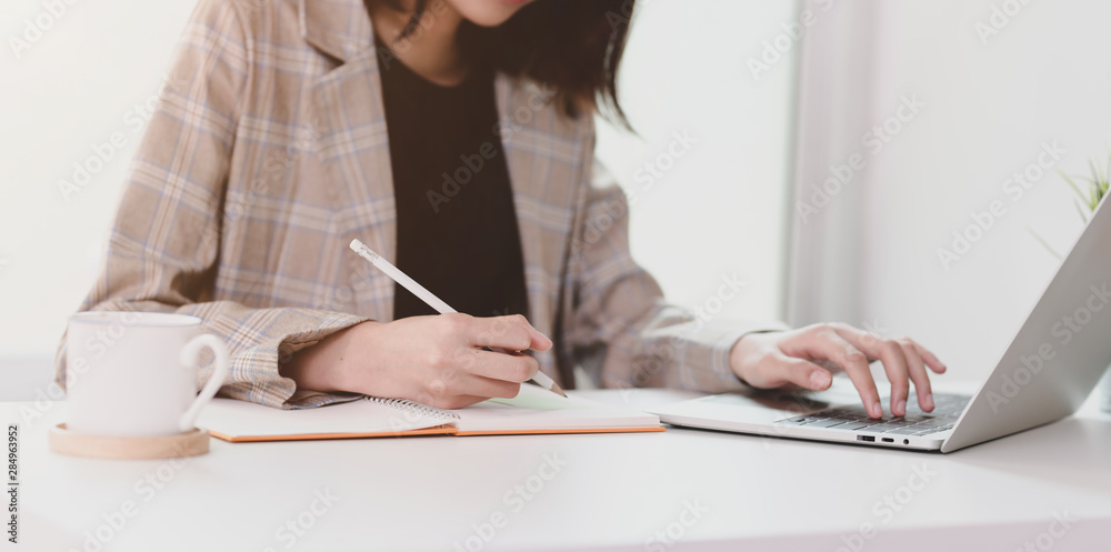 Motivated young businesswoman planing her strategy Motivated young businesswoman planing her strategy