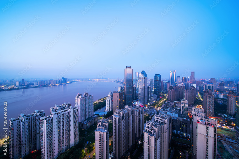 Fototapeta premium Nanchang, China，modern high-rise buildings line the new honggutan district in nanchang, jiangxi province. China's important manufacturing center and birthplace of the aviation industry