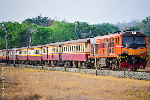 Old Thai-style trains that can still pick-up passengers on the train tracks