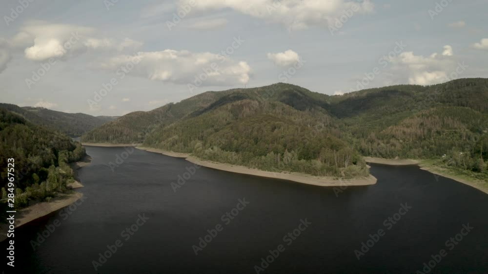 Scenic Drone Shot of a beautiful lake at sunset in the Harz National Park, Germany, Europe