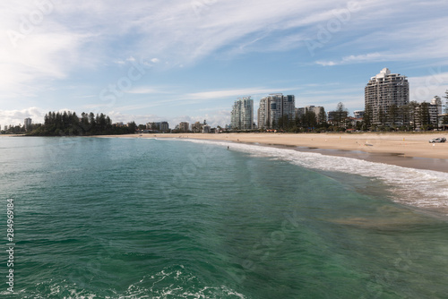 Coolangatta Beach with high-rises behind. Greenmount in the background. Gold Coast, Queensland, Australia.
