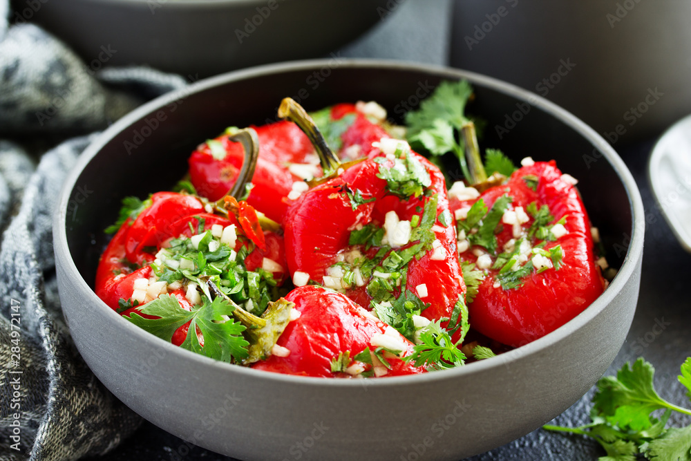 Baked bell peppers salad with herbs and garlic. Eastern dish. Baked bell peppers salad with herbs and garlic. Eastern dish.