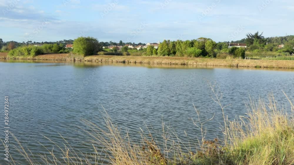 Large Ocean flood protection basin in front of the village of Saint-Trojan-les-Bains, Oleron island, France. Large Ocean flood protection basin in front of the village of Saint-Trojan-les-Bains, Oleron island, France.